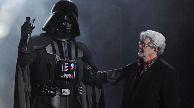 In this Oct. 15, 2011 file photo, "Darth Vader" accepts the Ultimate Villain award from Star Wars creator George Lucas during the 2011 Scream Awards.