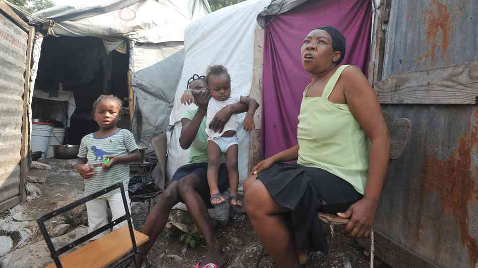 Hurricane Sandy's tear across the Caribbean left at least 54 dead in Haiti, where many people still live in tents because of damage from the 2010 earthquake.
