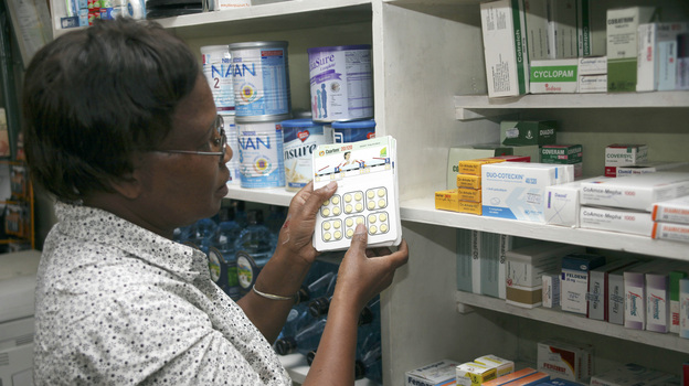 Dr. Esther Dalizu holds a pack of Coartem Malaria drugs in a pharmacy in Nairobi, Kenya, last year.