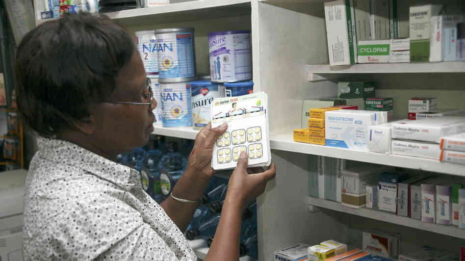 Dr. Esther Dalizu holds a pack of Coartem Malaria drugs in a pharmacy in Nairobi, Kenya, last year.