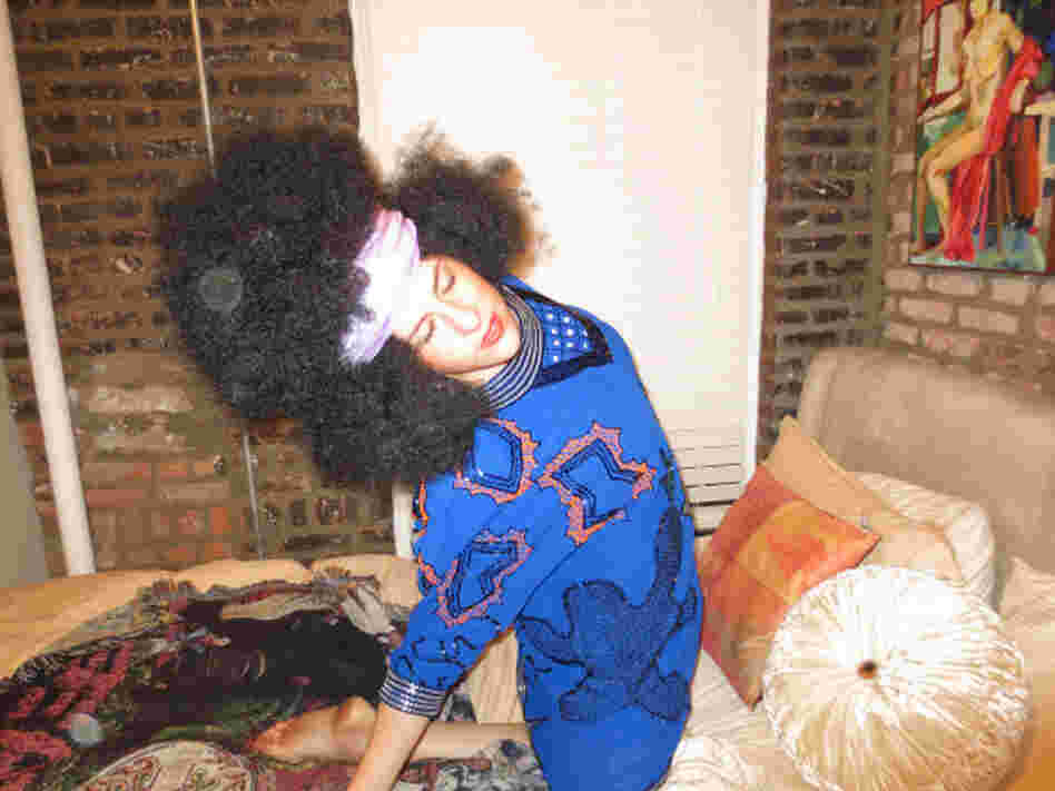 Michelle Joni Lapidos sports a big afro wig.