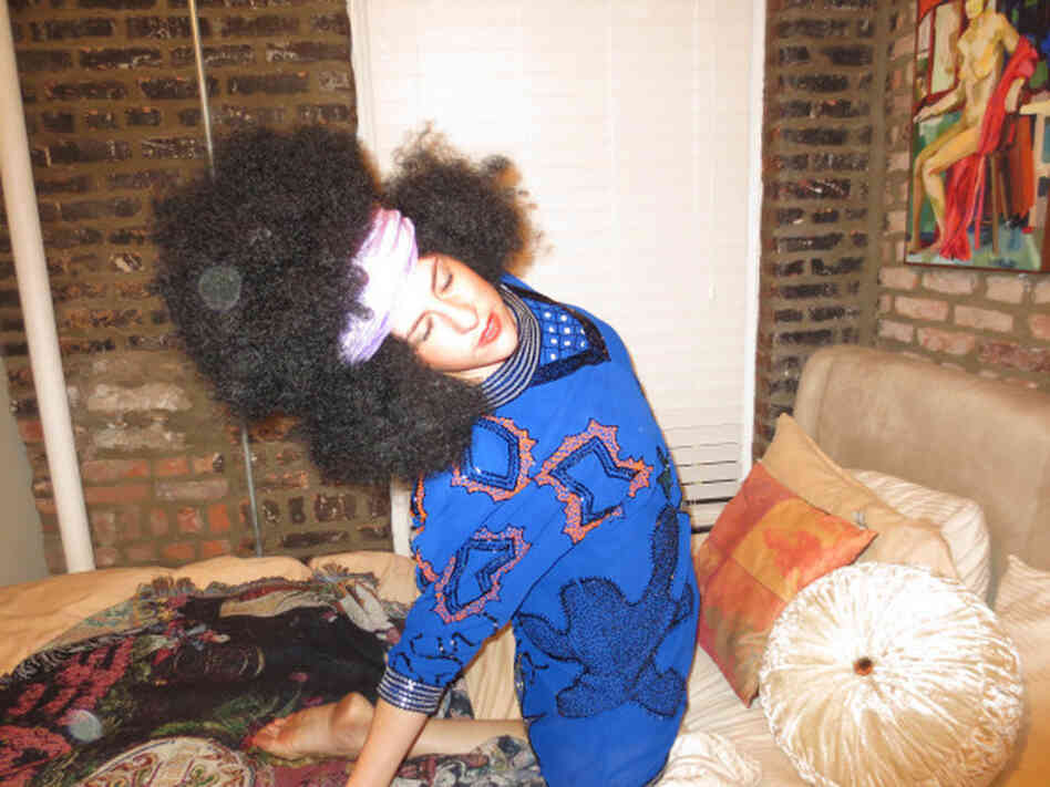 Michelle Joni Lapidos sports a big afro wig.