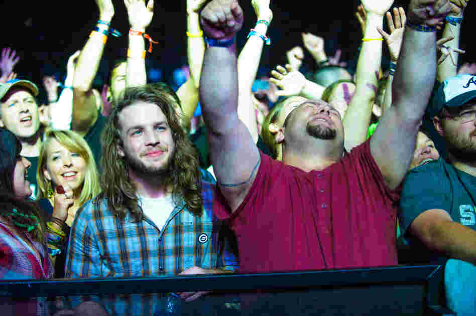 Fans lose themselves in a performance by the English electronic dance group Orbital, at the Explore Asheville Arena.