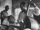 Bassist Percy Heath demonstrates a technique to a student at the summer jazz workshop in Lenox, Mass. in 1959.