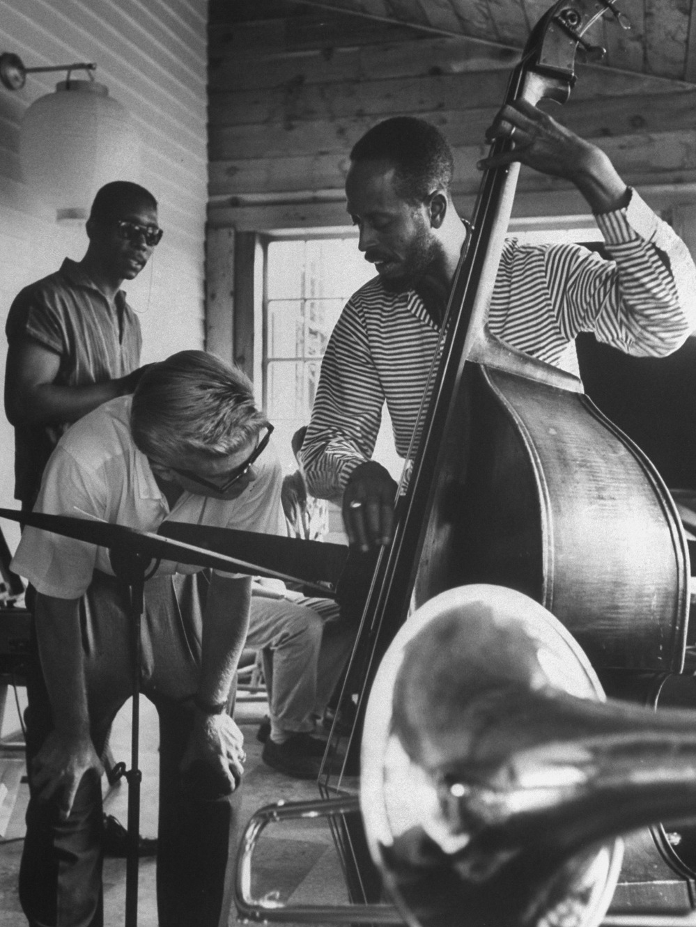 Bassist Percy Heath demonstrates a technique to a student at the summer jazz workshop in Lenox, Mass. in 1959.