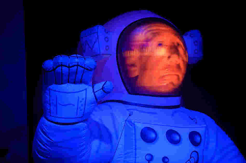 A grim-faced "Big Brother" spaceman waves to fans during Primus' show at the Explore Asheville Arena.