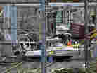 Workers try to clear boats and debris from the New Jersey Transit's Morgan draw bridge on Wednesday in South Amboy, N.J., after Monday's storm surge from Sandy pushed boats and cargo containers onto the train tracks.