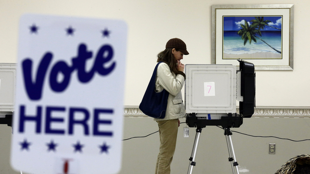 Kimberly Fisher cast her ballot Wednesday at a polling place at the Wicomico County Youth and Civic Center in Salisbury, Md.