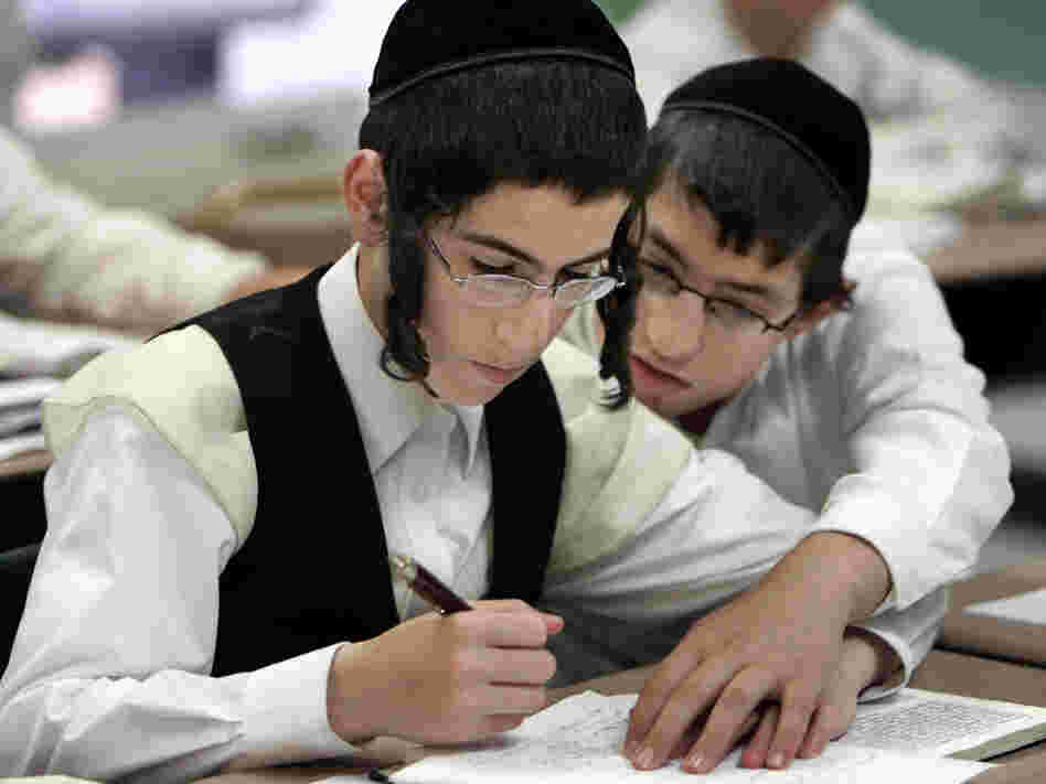 Two boys study together at a Chicago yeshiva in 2009. Public health officials say this type of close physical contact caused a mumps outbreak to spread throughout several orthodox Jewish communities in and around New York City.