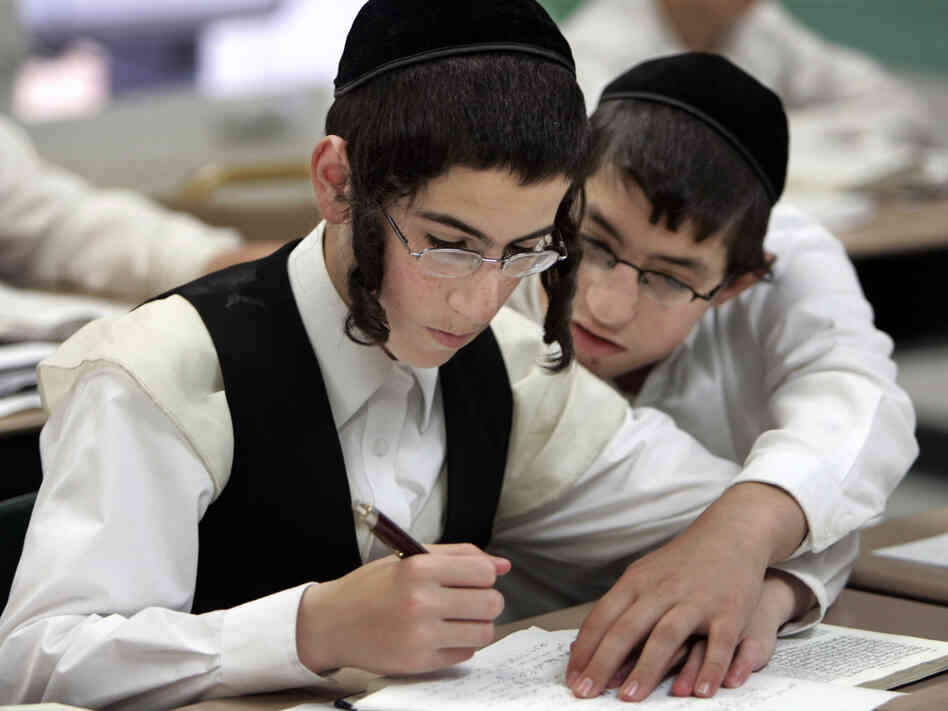 Two boys study together at a Chicago yeshiva in 2009. Public health officials say this type of close physical contact caused a mumps outbreak to spread throughout several orthodox Jewish communities in and around New York City.