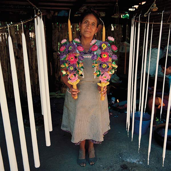 Biviana Alvarez Hipolito, candle maker, Teotitlan del Valle, Oaxaca. Every petal of the wax flowers is handmade from wax molds.