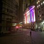 A man takes a photo of the New York Stock Exchange.