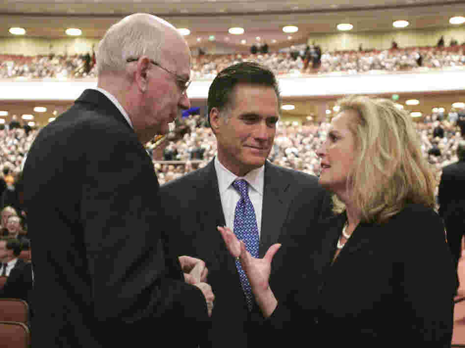 Mitt Romney, his wife, Ann, and then-Sen. Robert Bennett, R-Utah, attend the 2008 funeral of Gordon B. Hinckley, president of the Church of Jesus Christ of Latter-day Saints, in Salt Lake City.