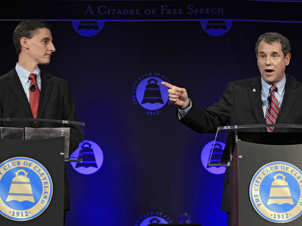 U.S. Sen. Sherrod Brown (right), D-Ohio, debates his Republican challenger, Ohio state Treasurer Josh Mandel, at the City Club in Cleveland on Oct. 15.