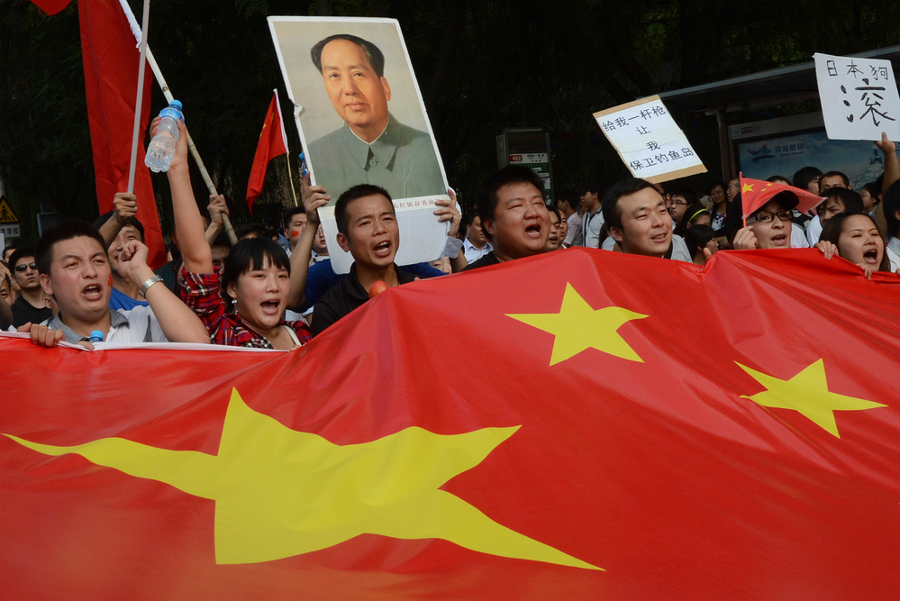 Chinese demonstrators carry their nation's flag during an anti-Japanese protest outside the Japanese Embassy in Beijing on Sept. 15. The countries are involved in a dispute over the Diaoyu Islands, known as the Senkaku Islands in Japanese.