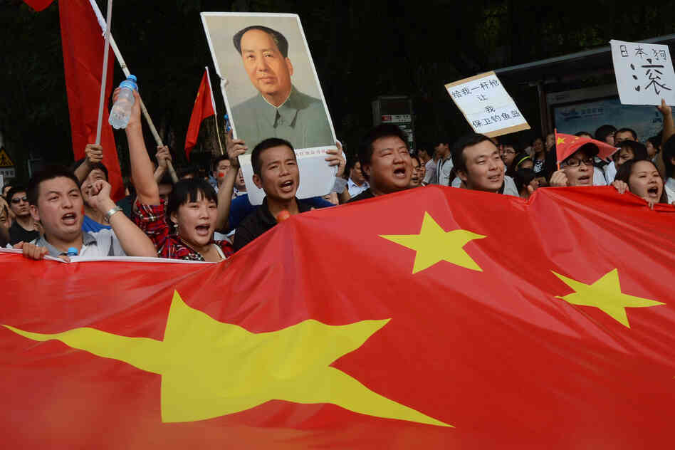 Chinese demonstrators carry their nation's flag during an anti-Japanese protest outside the Japanese Embassy in Beijing on Sept. 15. The countries are involved in a dispute over the Diaoyu Islands, known as the Senkaku Islands in Japanese.