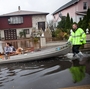 An emergency responder helps residents of Little Ferry, N.J., after their neighborhood was flooded due to Superstorm Sandy. An emergency responder helps residents of Little Ferry, N.J., after their neighborhood was flooded due to Superstorm Sandy.