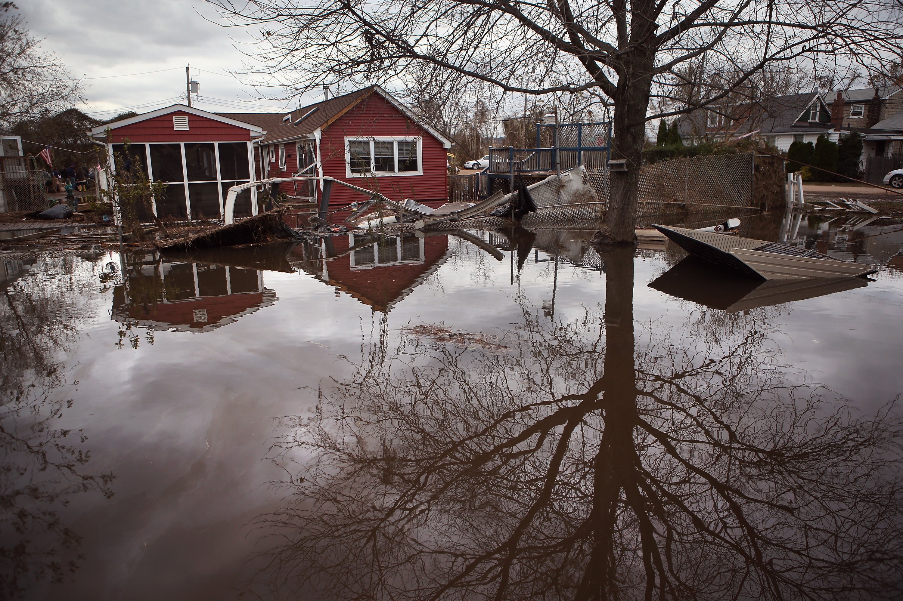 Water continues to flood a neighborhood on Thursday in the Ocean Breeze area of the Staten Island borough of New York City. Water continues to flood a neighborhood on Thursday in the Ocean Breeze area of the Staten Island borough of New York City.