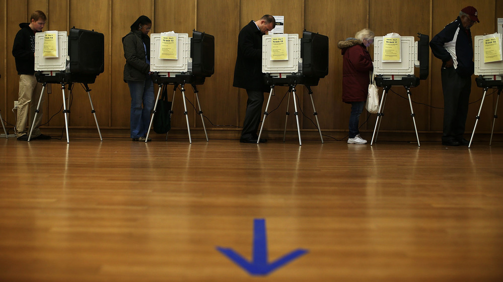 Voters participate in early voting Friday in Silver Spring, Md.