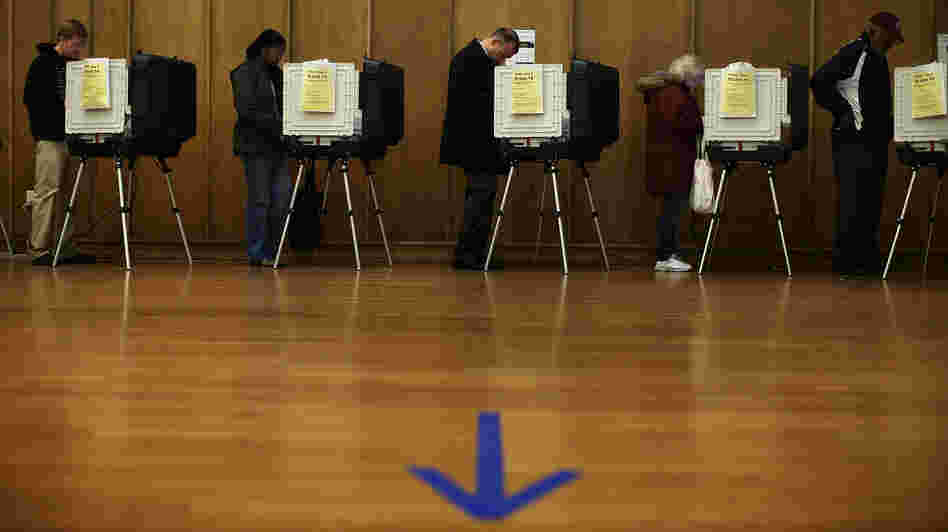 Voters participate in early voting Friday in Silver Spring, Md.