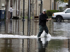 A man crosses a flooded street in the wake of Superstorm Sandy on Thursday in Little Ferry, N.J. Surprise coastal surge floods caused by the storm battered Little Ferry, Moonachie and some other towns along the Hackensack River in Bergen County, all areas unaccustomed to flooding. A man crosses a flooded street in the wake of Superstorm Sandy on Thursday in Little Ferry, N.J. Surprise coastal surge floods caused by the storm battered Little Ferry, Moonachie and some other towns along the Hackensack River in Bergen County, all areas unaccustomed to flooding.