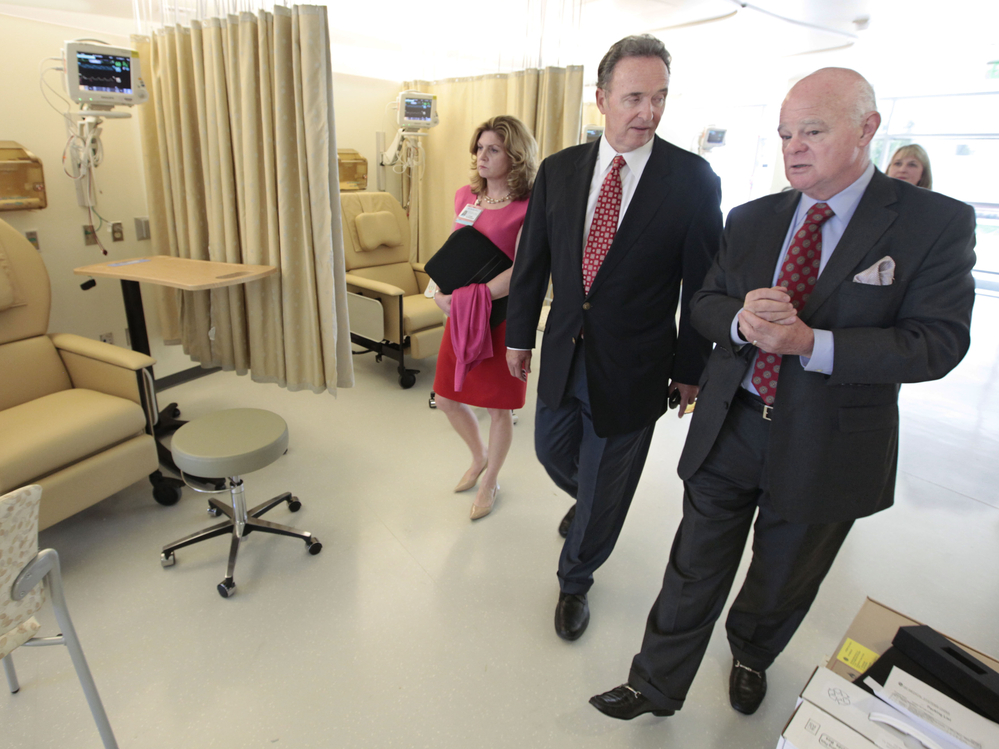 Republican Congressman Dan Lungren (center) tours a cancer center in Sacramento, Calif. Lungren is running for re-election in California's 7th Congressional District.