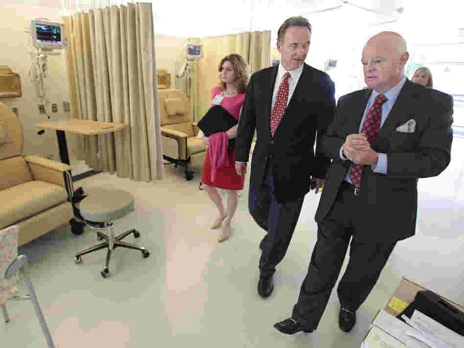 Republican Congressman Dan Lungren (center) tours a cancer center in Sacramento, Calif. Lungren is running for re-election in California's 7th Congressional District.