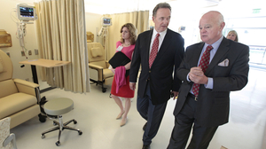 Republican Congressman Dan Lungren (center) tours a cancer center in Sacramento, Calif. Lungren is running for re-election in California's 7th Congressional District.