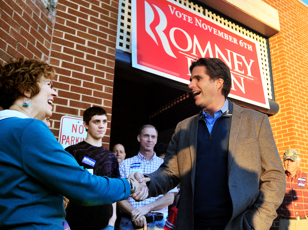 Tagg Romney, the eldest son of presidential candidate Mitt Romney, shakes hands with Barbara Irby at GOP headquarters in Lynchburg, Va., last month. Tagg Romney, the eldest son of presidential candidate Mitt Romney, shakes hands with Barbara Irby at GOP headquarters in Lynchburg, Va., last month.