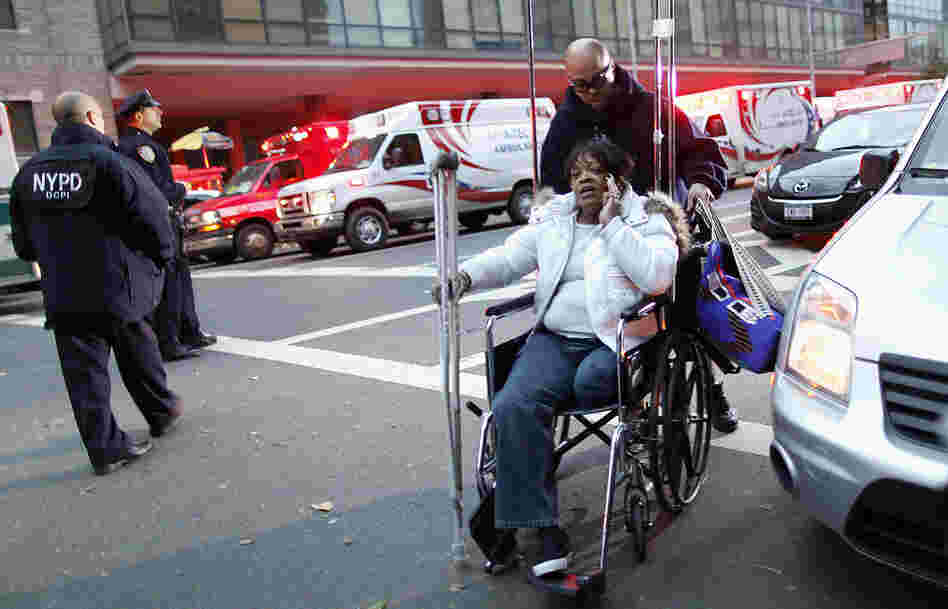 Barbara Fleming is evacuated from Bellevue Hospital by Victor Rivera in the aftermath of Superstorm Sandy in New York on Oct. 31. Barbara Fleming is evacuated from Bellevue Hospital by Victor Rivera in the aftermath of Superstorm Sandy in New York on Oct. 31.