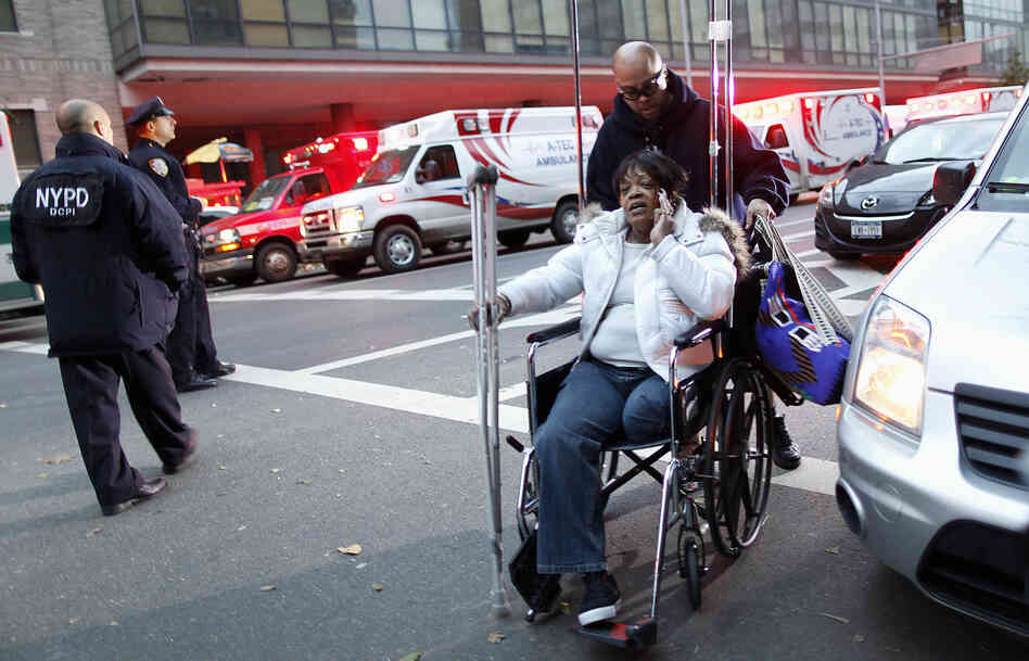 Barbara Fleming is evacuated from Bellevue Hospital by Victor Rivera in the aftermath of Superstorm Sandy in New York on Oct. 31. Barbara Fleming is evacuated from Bellevue Hospital by Victor Rivera in the aftermath of Superstorm Sandy in New York on Oct. 31.