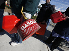 Rather than sit in their cars, many people on Staten Island today lined up at stations with gas cans — hoping to get a few gallons before supplies ran out. Rather than sit in their cars, many people on Staten Island today lined up at stations with gas cans — hoping to get a few gallons before supplies ran out.