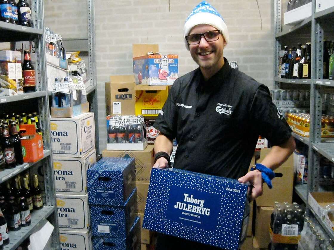 Jacob Lyby, a bar manager at Fox and Hounds in Herning, Denmark holding a case of the special Danish Christmas beer being released tonight in Denmark.
