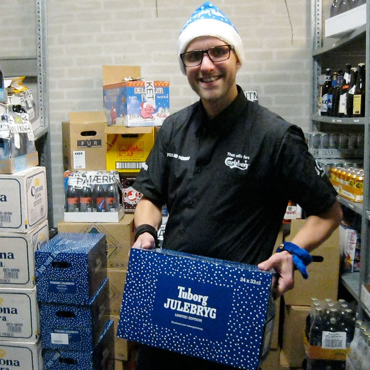 Jacob Lyby, a bar manager at Fox and Hounds in Herning, Denmark holding a case of the special Danish Christmas beer being released tonight in Denmark.
