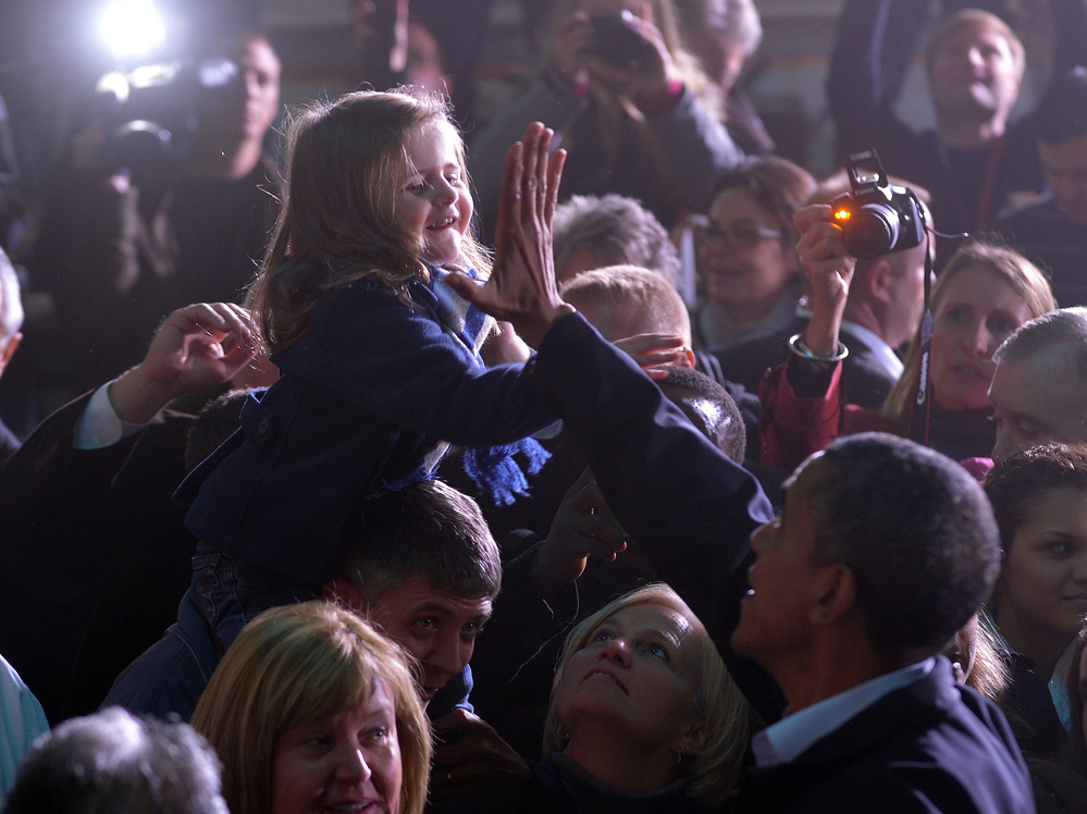 President Obama gives a girl a high five at a campaign rally in Hilliard, Ohio, on Nov. 2.