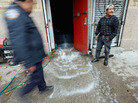 Water was being pumped out of this business in Manhattan's East Village on Thursday. Water was being pumped out of this business in Manhattan's East Village on Thursday.