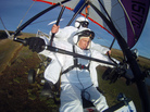 Russian President Vladimir Putin pilots a motorized hang glider while taking part in a project to help endangered cranes on Sept. 5. Shortly after, the president — who has cultivated the image of a man of action — was photographed wincing in apparent pain. Russian President Vladimir Putin pilots a motorized hang glider while taking part in a project to help endangered cranes on Sept. 5. Shortly after, the president — who has cultivated the image of a man of action — was photographed wincing in apparent pain.