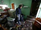 Steve Santo stands in what used to be the kitchen of his house after it was destroyed by storm surge flooding on the south side Staten Island in New York City following Superstorm Sandy on Friday. Steve Santo stands in what used to be the kitchen of his house after it was destroyed by storm surge flooding on the south side Staten Island in New York City following Superstorm Sandy on Friday.