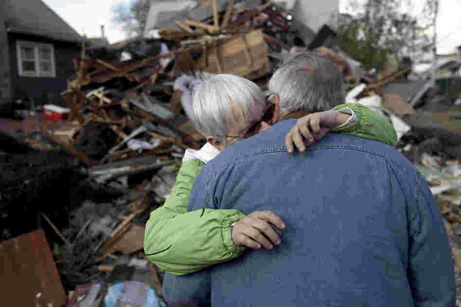 Sheila and Dominic Traina hug in front of their home, which was demolished.