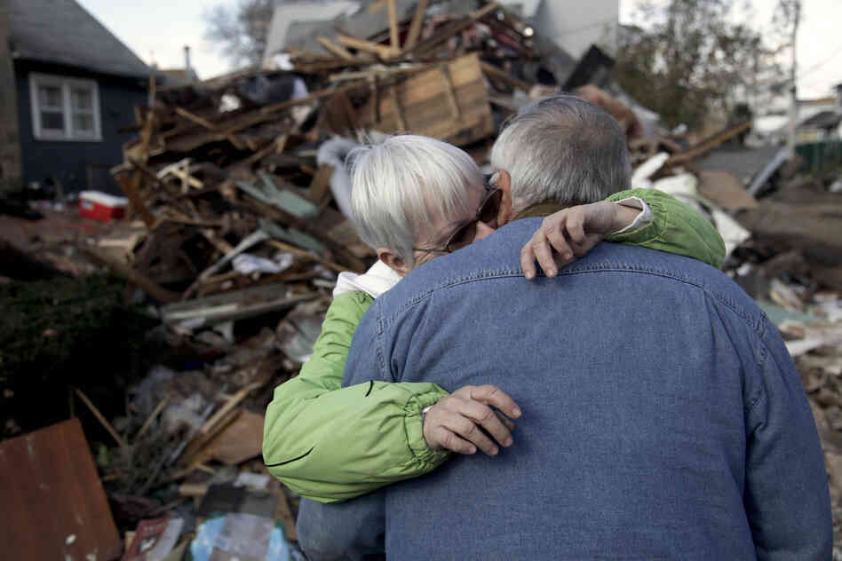 Sheila and Dominic Traina hug in front of their home, which was demolished.