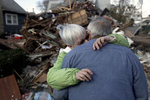 Sheila and Dominic Traina hug in front of their home, which was demolished.
