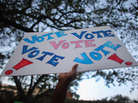 A sign reading "Vote" is held up during a rally for President Obama on Oct. 27 in Miami, Fla. A sign reading "Vote" is held up during a rally for President Obama on Oct. 27 in Miami, Fla.