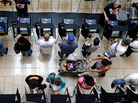 Voters cast their ballots during the first day of early voting at the Meadows Mall on Oct. 20 in Las Vegas, Nev. Voters cast their ballots during the first day of early voting at the Meadows Mall on Oct. 20 in Las Vegas, Nev.