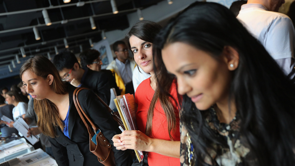 Job applicants meet potential employers at the NYC Startup Job Fair held in September. Last month, the private sector created jobs while the public sector resumed laying off workers.