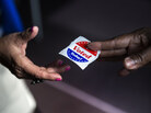 A poll worker hands out "I Voted Today" stickers during the first day of early voting October 22, 2012 in Washington, DC. Citizens of the District of Columbia began early voting today for the November 6th elections which will include the 2012 US Presidential election. AFP PHOTO/Brendan SMIALOWSKI (Photo credit should read BRENDAN SMIALOWSKI/AFP/Getty Images) A poll worker hands out "I Voted Today" stickers during the first day of early voting October 22, 2012 in Washington, DC. Citizens of the District of Columbia began early voting today for the November 6th elections which will include the 2012 US Presidential election. AFP PHOTO/Brendan SMIALOWSKI (Photo credit should read BRENDAN SMIALOWSKI/AFP/Getty Images)