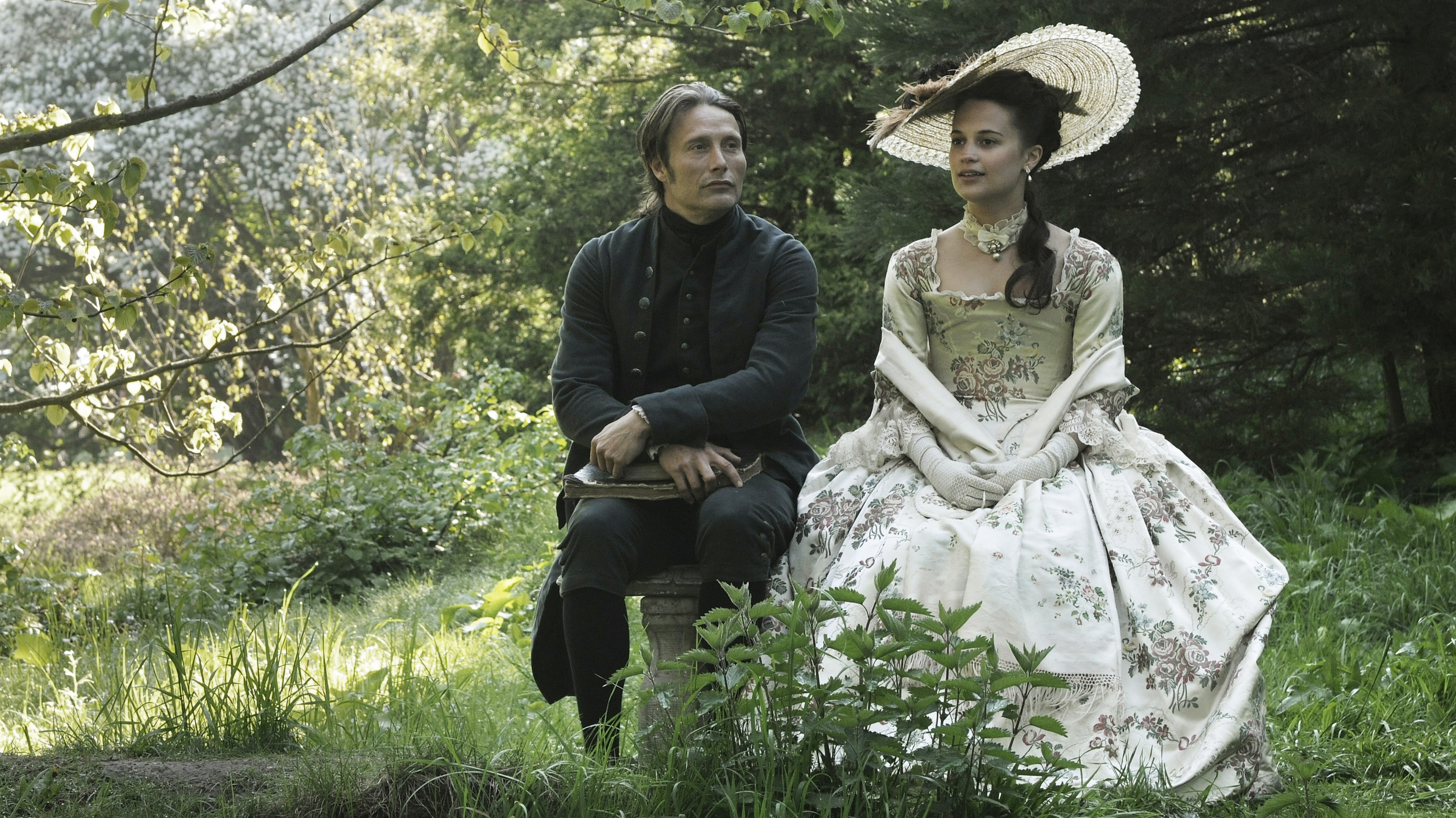 The titular affair takes place between the Queen of Denmark (Alicia Vikander) and her ailing husband's physician (Mads Mikkelsen).