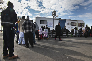 Victims of Superstorm Sandy wait in line to apply for recovery assistance at a FEMA processing center Friday on New York's Coney Island. The agency has been praised for its response to the storm.