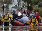 First responders rescue flood-stranded people from a sodden neighborhood in Little Ferry, N.J., on Tuesday. First responders rescue flood-stranded people from a sodden neighborhood in Little Ferry, N.J., on Tuesday.
