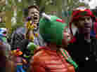 A marcher with a puppet of Bert, the Muppet character from Sesame Street, shouts during The Million Muppet March in Washington, D.C., on Saturday. The bipartisan rally was organized to show support for public broadcasting following Republican presidential candidate Mitt Romney's pledge to cut funding to PBS.