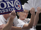 Melissa Fults, treasurer for Arkansans for Compassionate Care, holds up cards at the back of a news conference in Little Rock, Ark., with the names of doctors she says support a ballot issue that would legalize medical marijuana. Melissa Fults, treasurer for Arkansans for Compassionate Care, holds up cards at the back of a news conference in Little Rock, Ark., with the names of doctors she says support a ballot issue that would legalize medical marijuana.